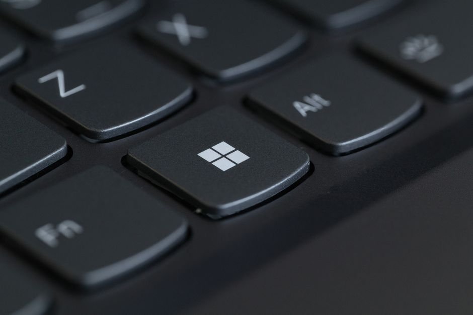 Close-up of a computer keyboard with the Windows key in focus