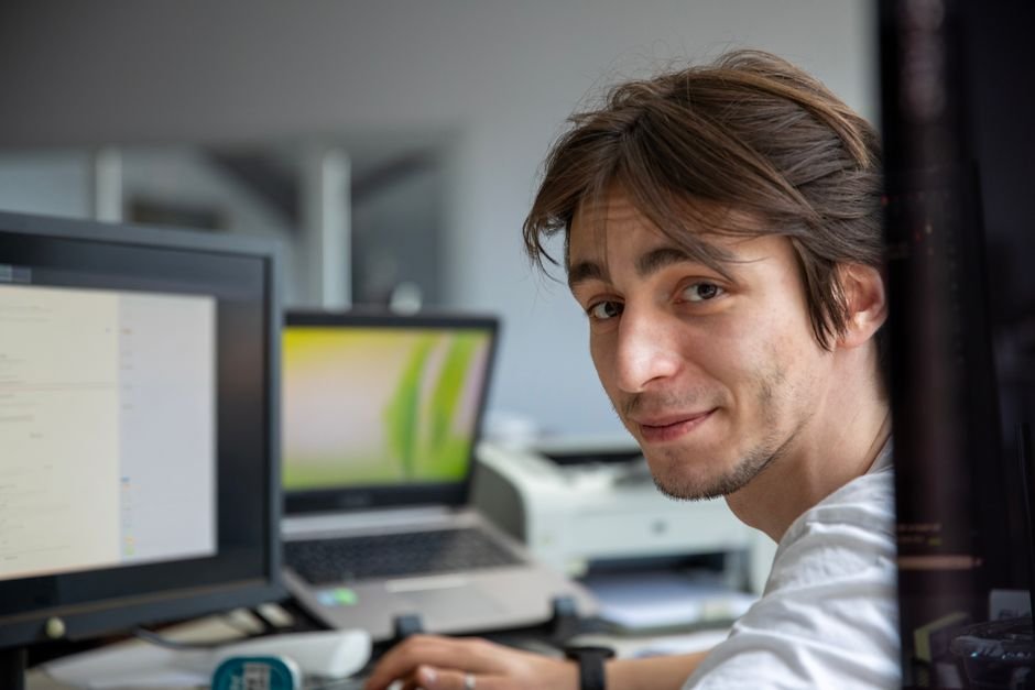 Professional working at a desk in a modern office