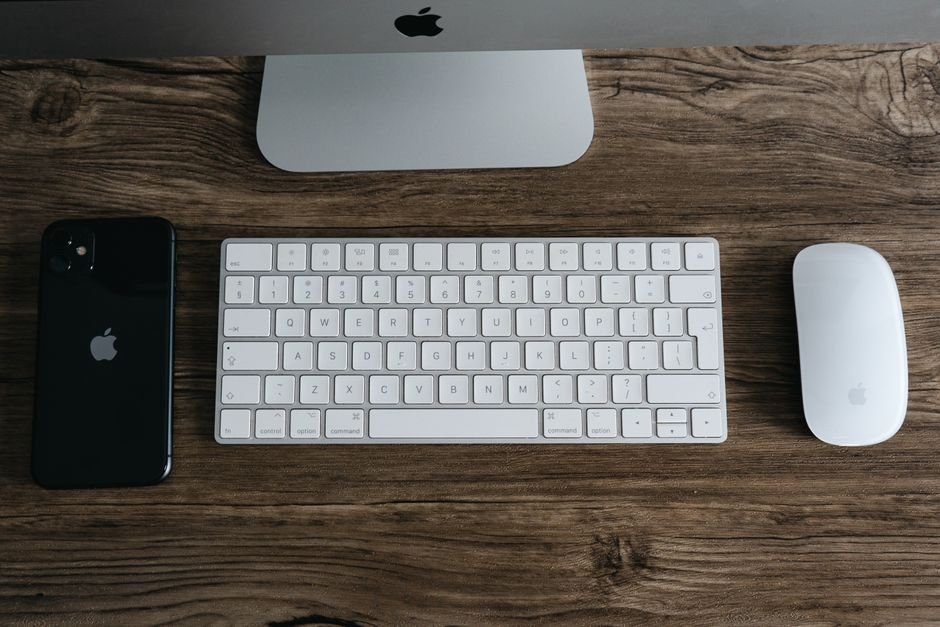 Minimalist workspace with smartphone keyboard and mouse