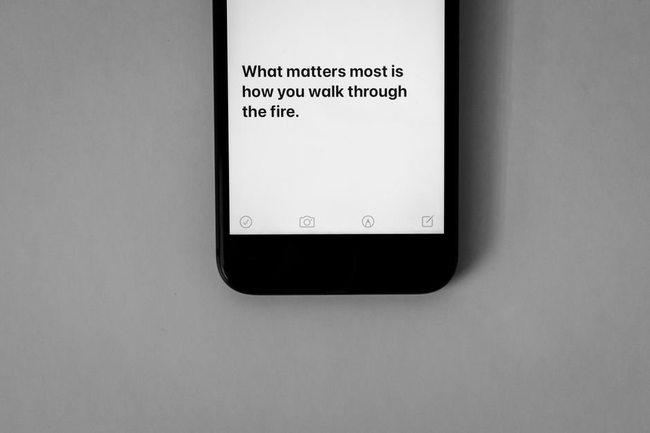 Person unplugging from a smartphone, embracing a digital detox