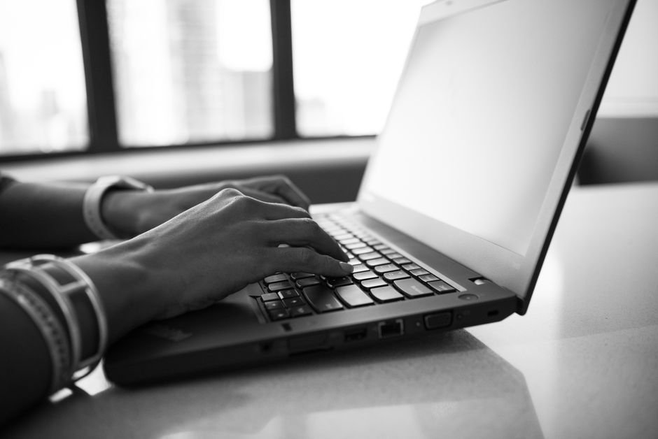 Desk setup with modern laptop displaying technology environment