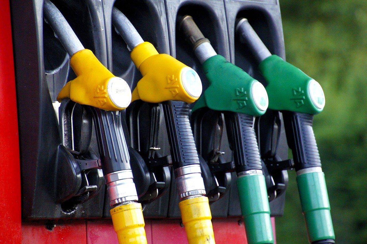 Gas pump fueling a car at a station