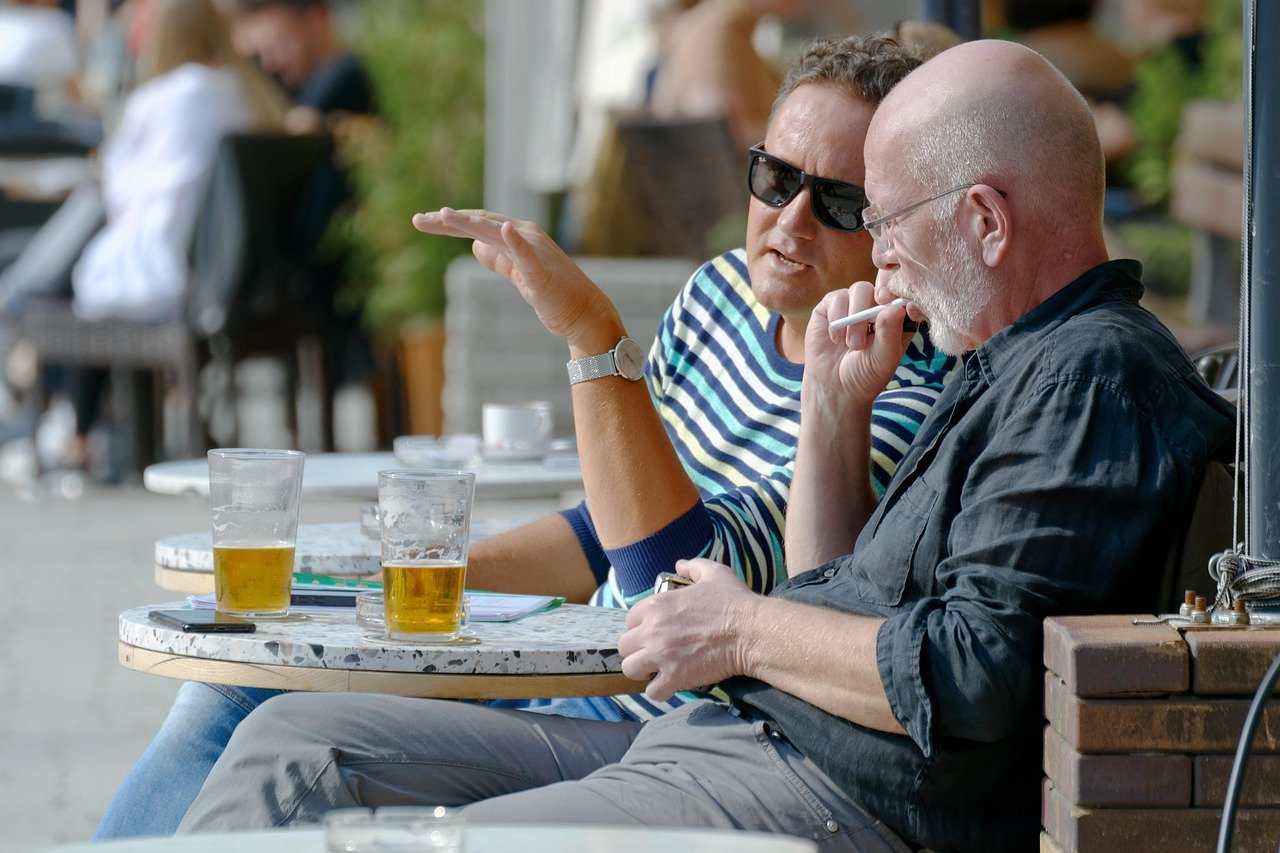 Friends communicating positively over drinks